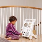 Biscotti@little girl playing with activity walker
