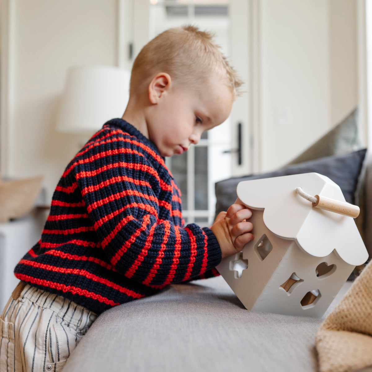 Ivory@Baby using a shape sorter to practice fine motor skills