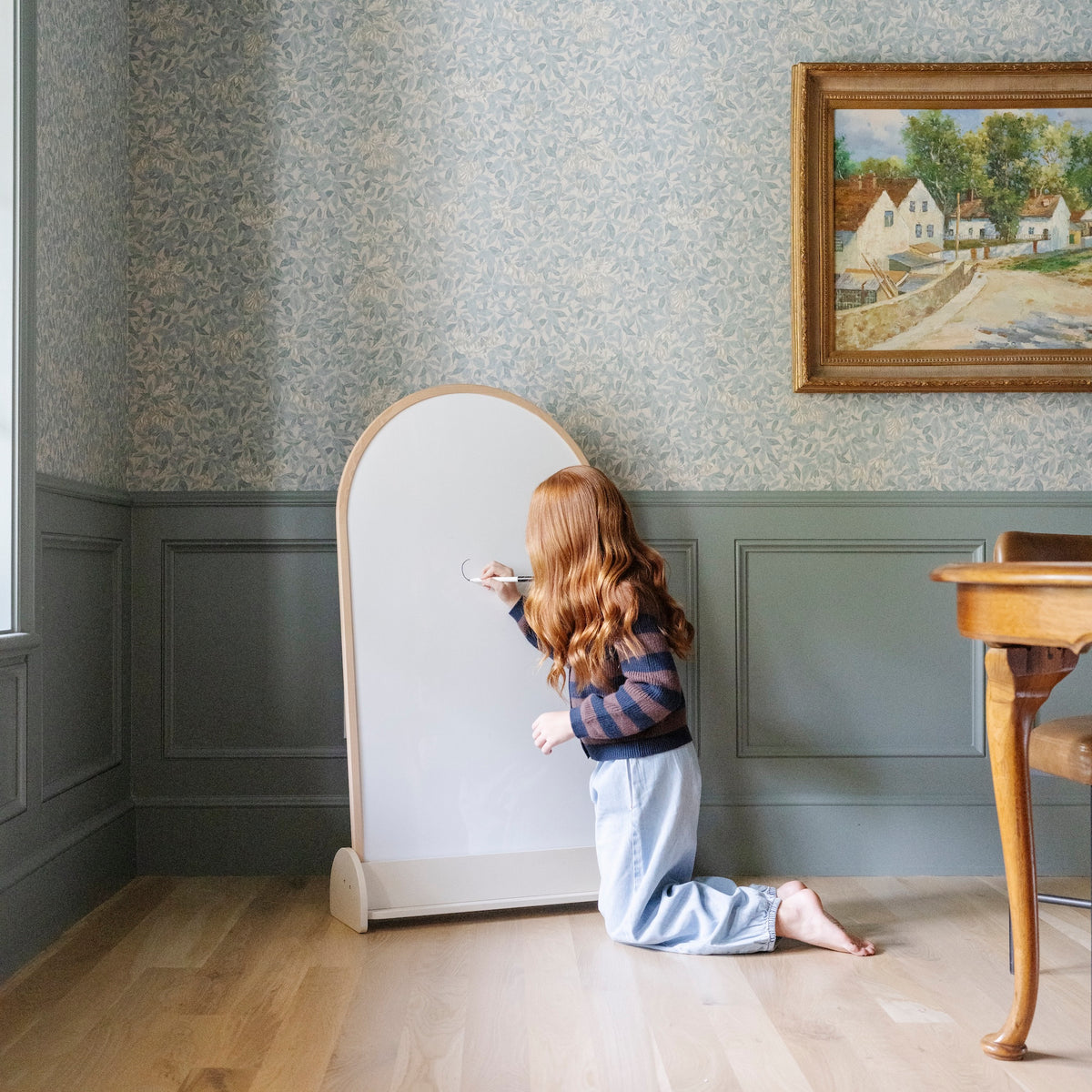 Beech@Child using a kids chalkboard for drawing and magnetic play at home