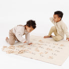 Birch@Kids playing with Wooden Letters on the Mini Alphabet Mat