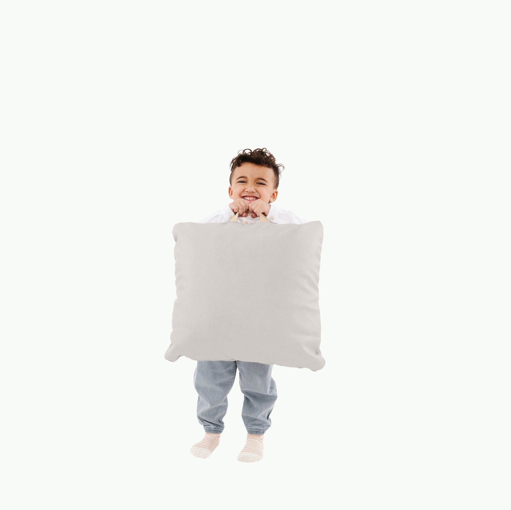Gull (on sale) / Square@Kid holding the Gull Square Mini Floor Cushion