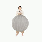 Houndstooth (on sale) / Circle@Woman holding the Houndstooth Circle Floor Cushion