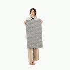 Houndstooth (on sale)@woman holding the houndstooth micro+ mat