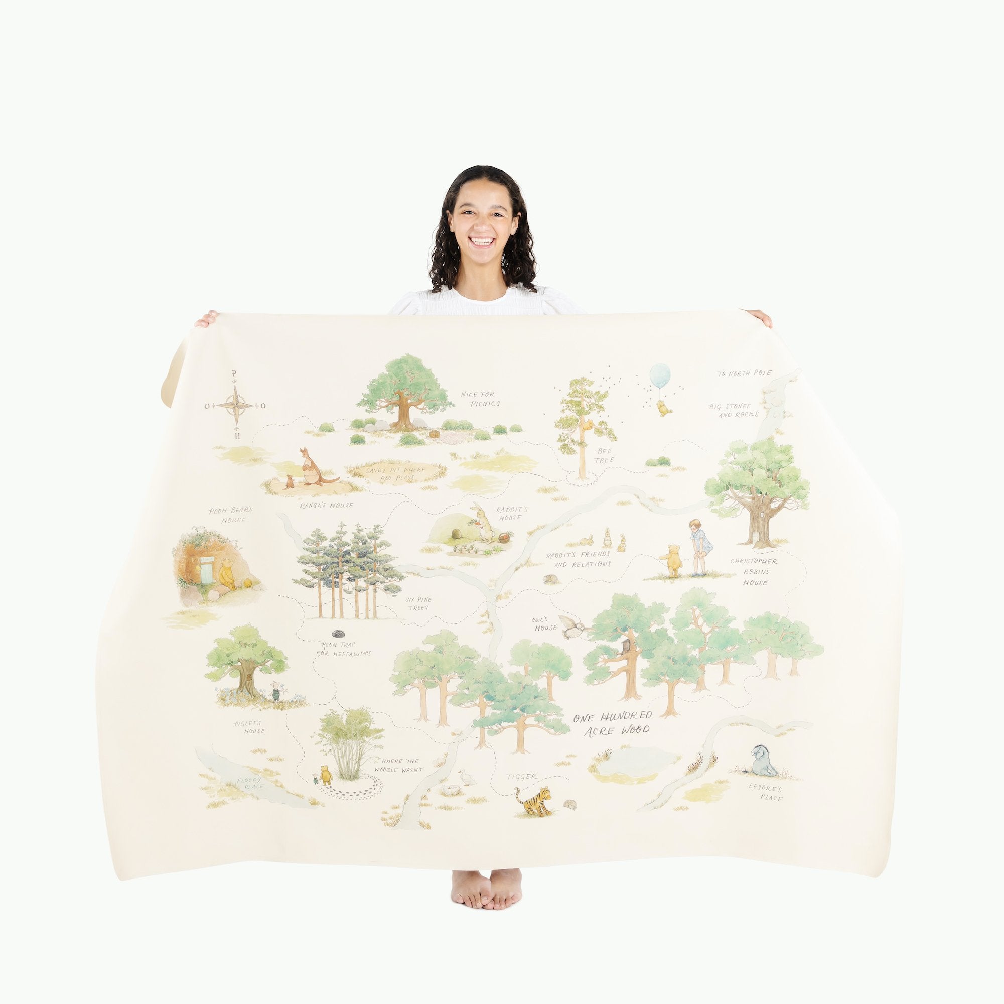 Hundred Acre Wood (on sale)@Woman holding the Hundred Acre Wood Midi+ Mat