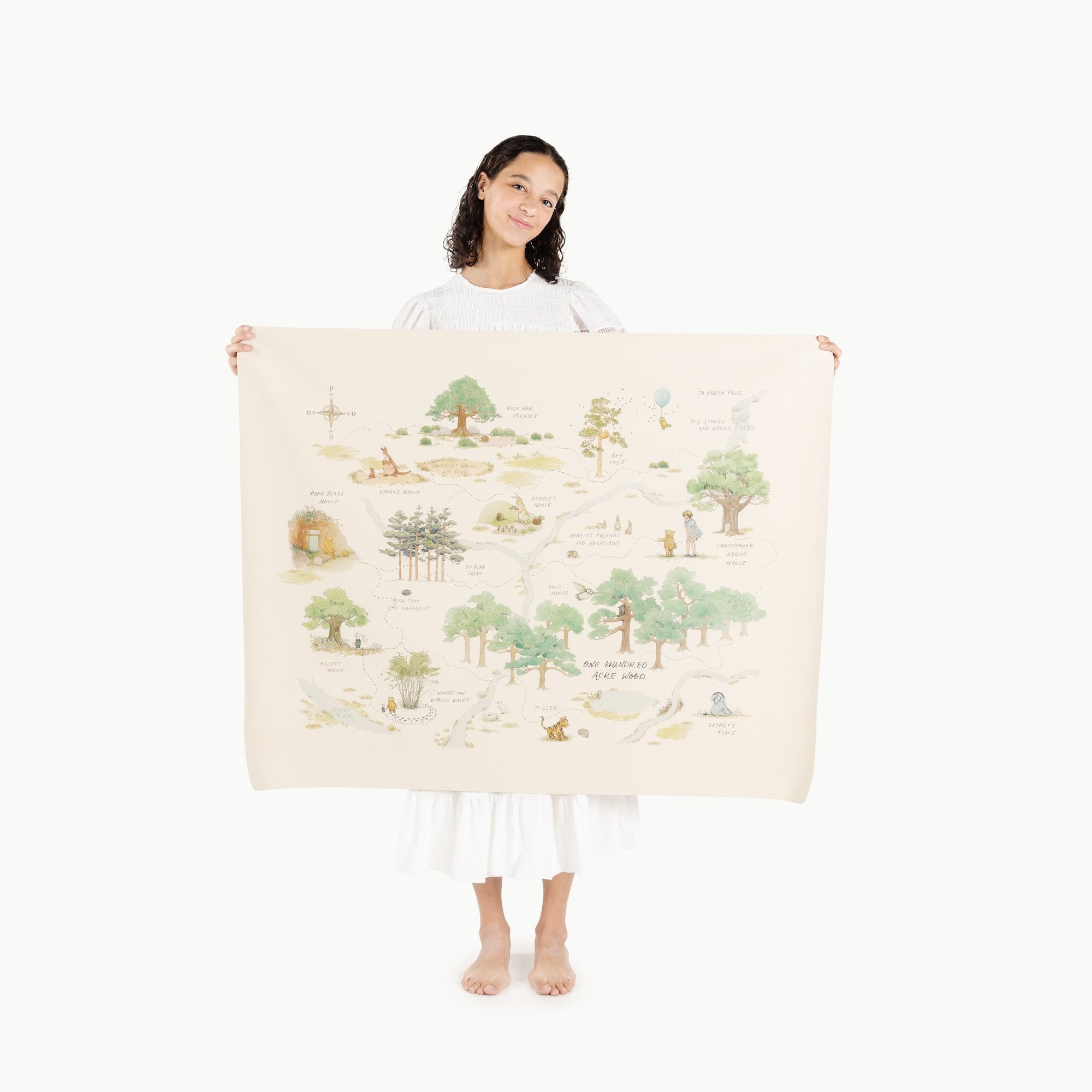 Hundred Acre Wood (on sale)@Woman holding the Hundred Acre Wood Mini+ Mat