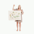 Hundred Acre Wood (on sale)@Woman holding the Hundred Acre Wood Poster
