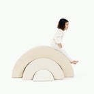 Wool • Ivory • Alabaster@Kid playing on the Ivory Arc Playset