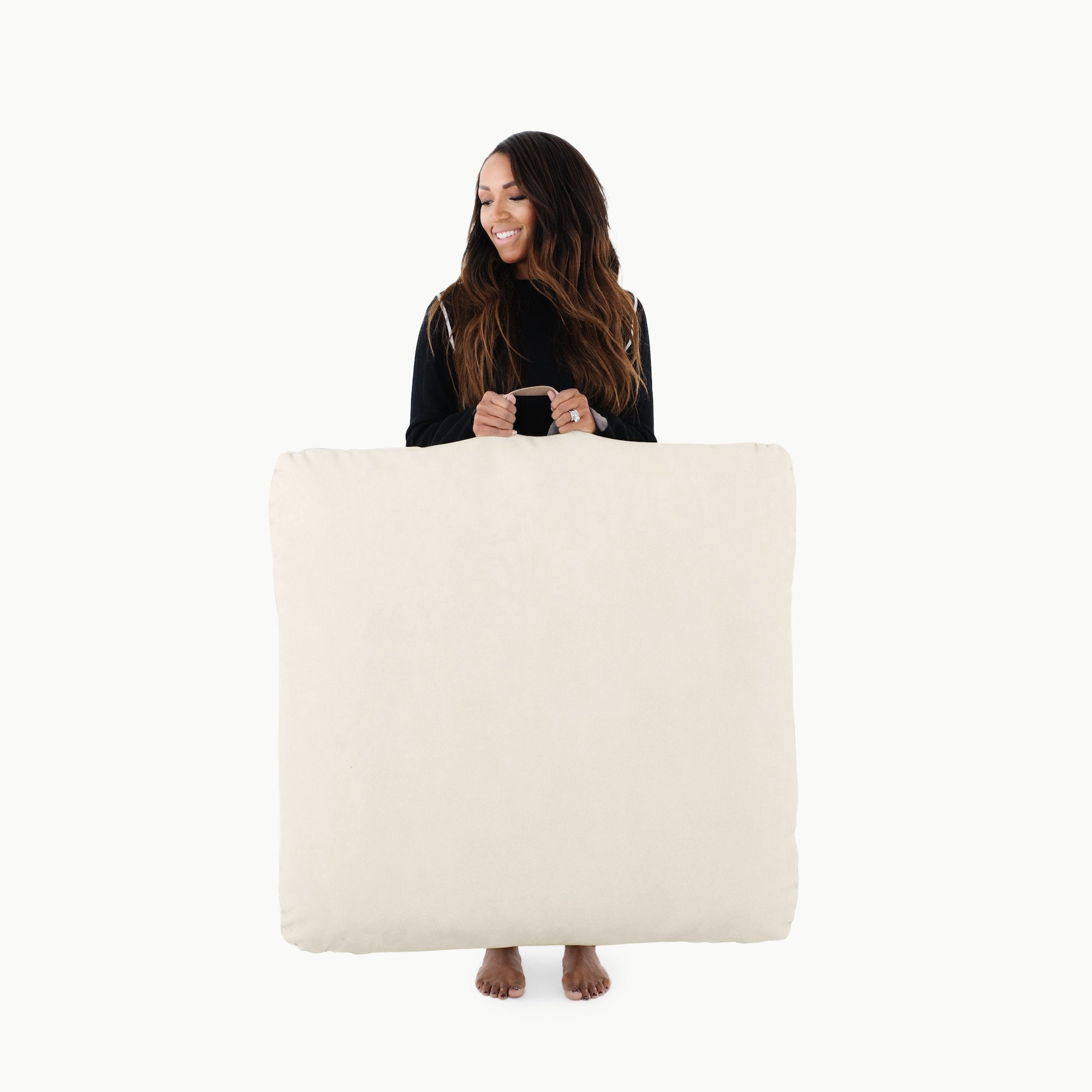 Ivory / Square@Woman holding the Ivory Square Floor Cushion