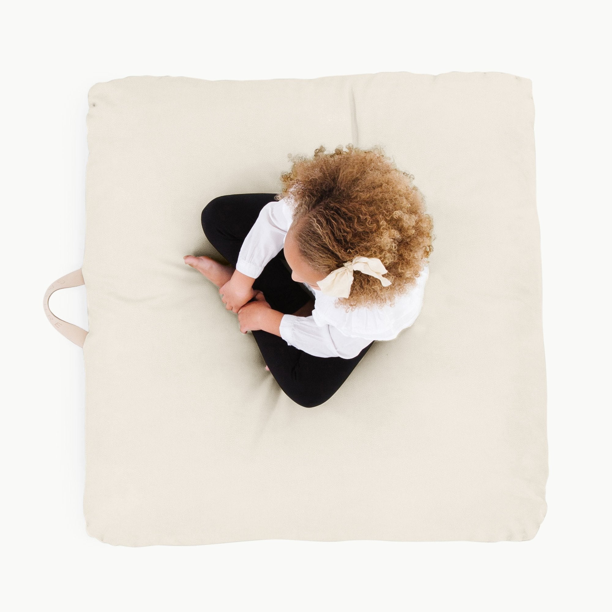 Ivory / Square@Overhead kid sitting on the Ivory Square Floor Cushion