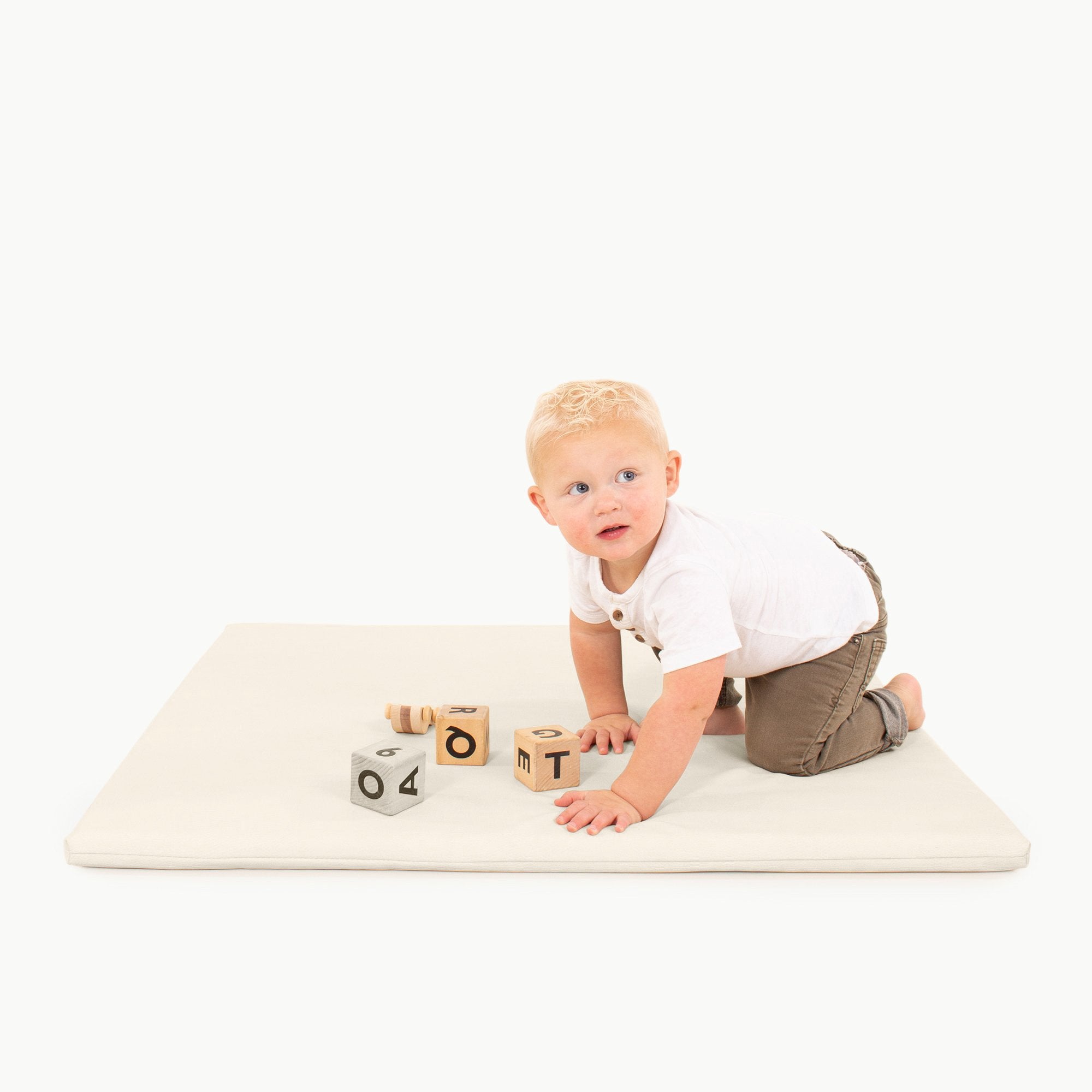 Ivory / Square@kid playing on the ivory padded mini square