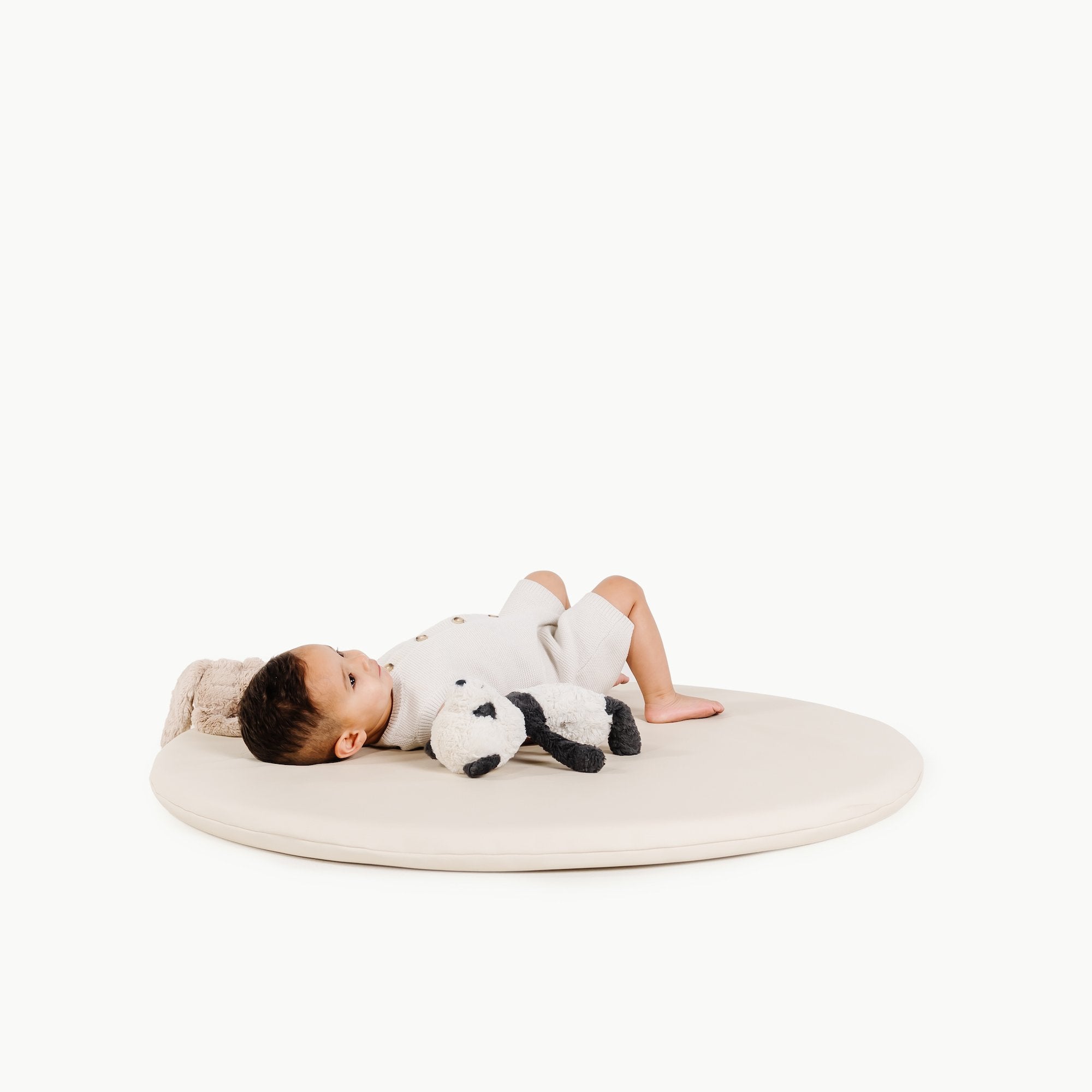 Ivory / Circle@Boy laying on Ivory Padded Mini Circle