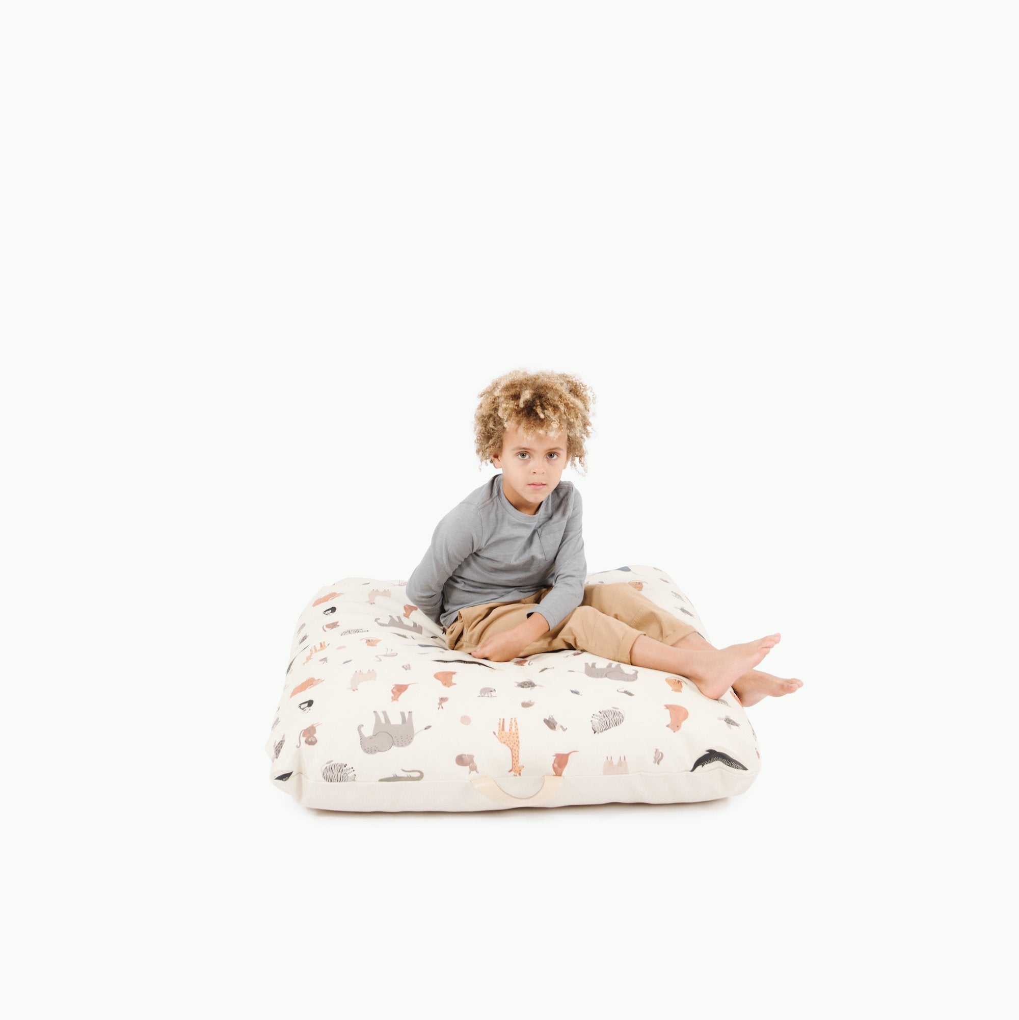 Menagerie / Square@Kid sitting on the Menagerie Square Floor Cushion