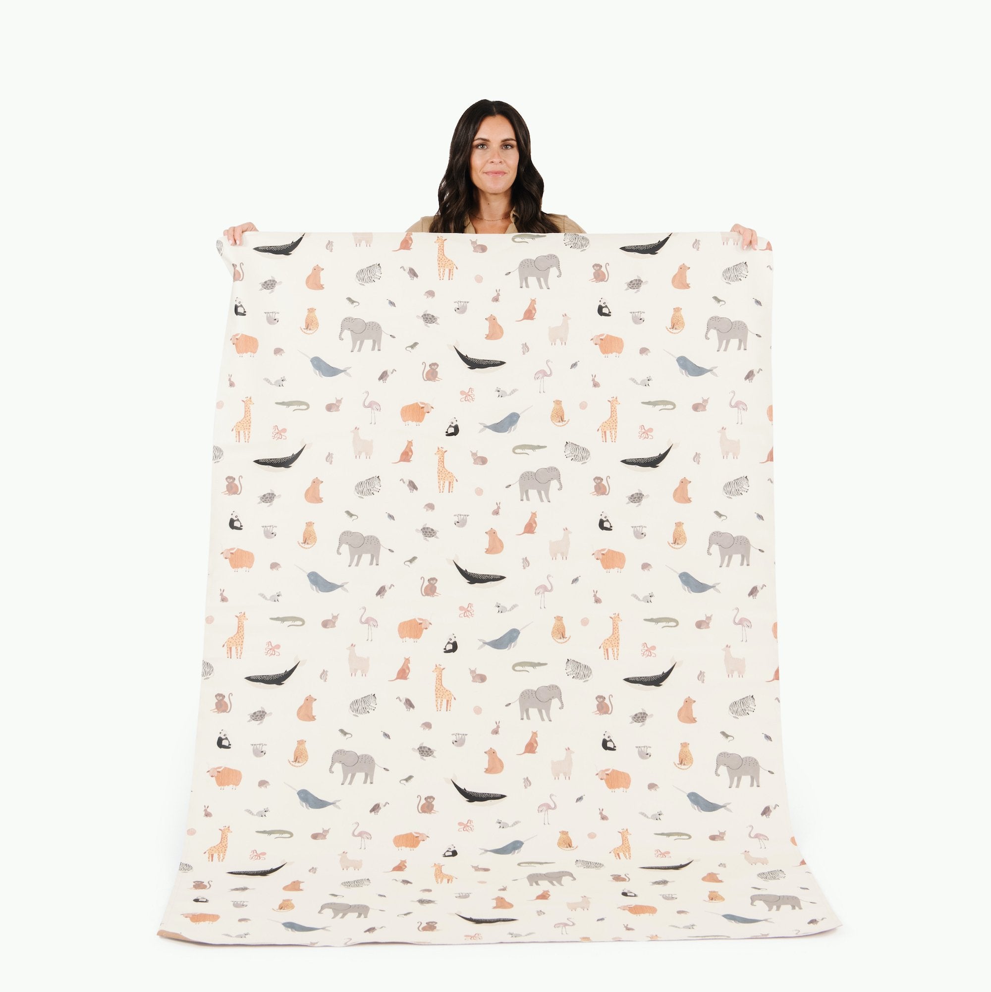 Menagerie (on sale)@Woman holding the Menagerie Midi+ Mat