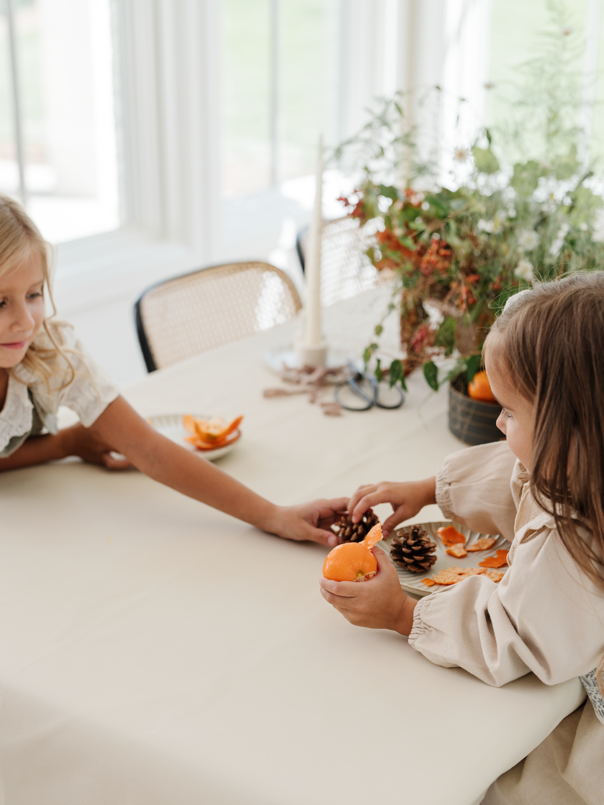 Kids sitting at a table with a Gathre Tablecloth on it. 