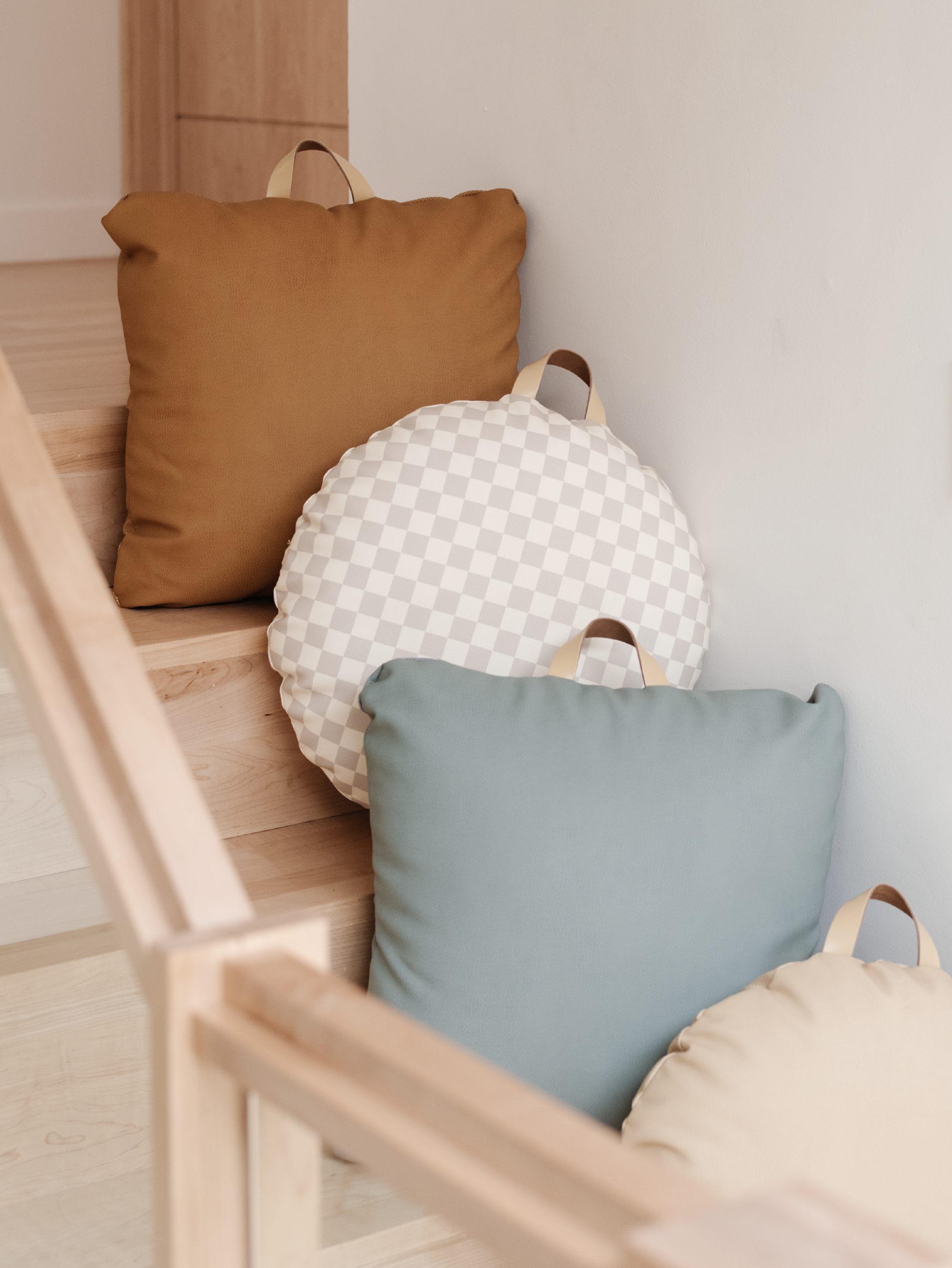 Gathre Mini Floor Cushions on stairs.