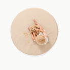 Millet / Circle@overhead of kid playing on the millet padded mini circle