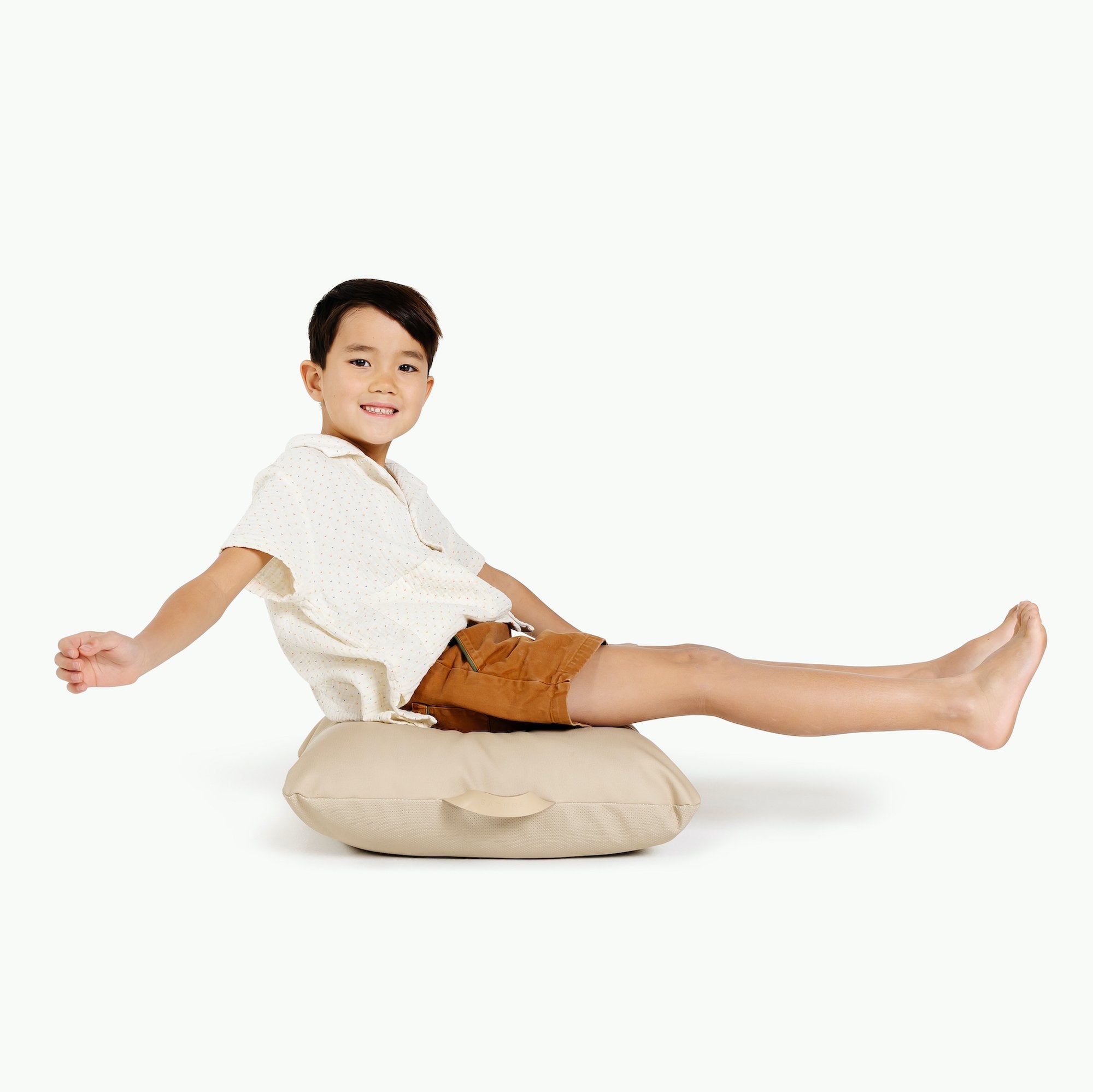 Millet / Square@Kid sitting on the Millet Mini Square Floor Cushion