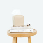 Millet@Millet Tissue Box Cover on table with books