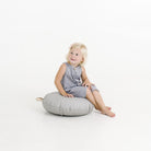 Pewter (on sale) / Circle@Kid sitting on the Pewter Circle Mini Floor Cushion