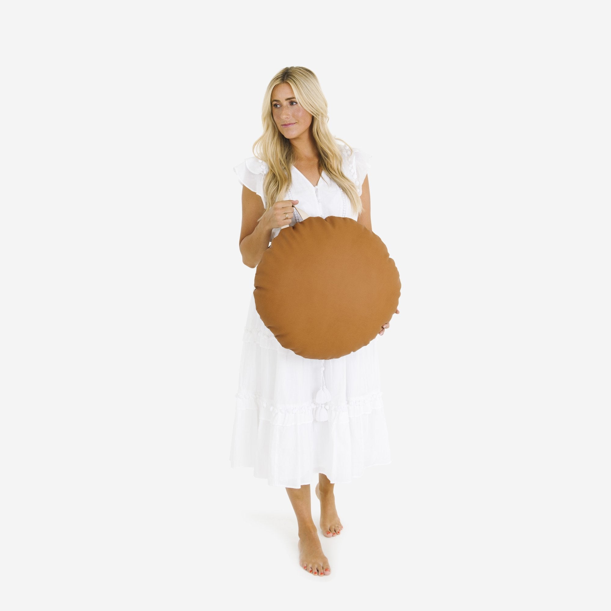 Ginger (on sale) / Circle@Woman holding the Ginger Circle Mini Floor Cushion