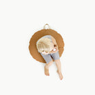 Ginger (on sale) / Circle@overhead of kid sitting on the ginger circle floor cushion