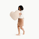 Paloma (on sale)@Kid holding the Paloma Heart Pillow