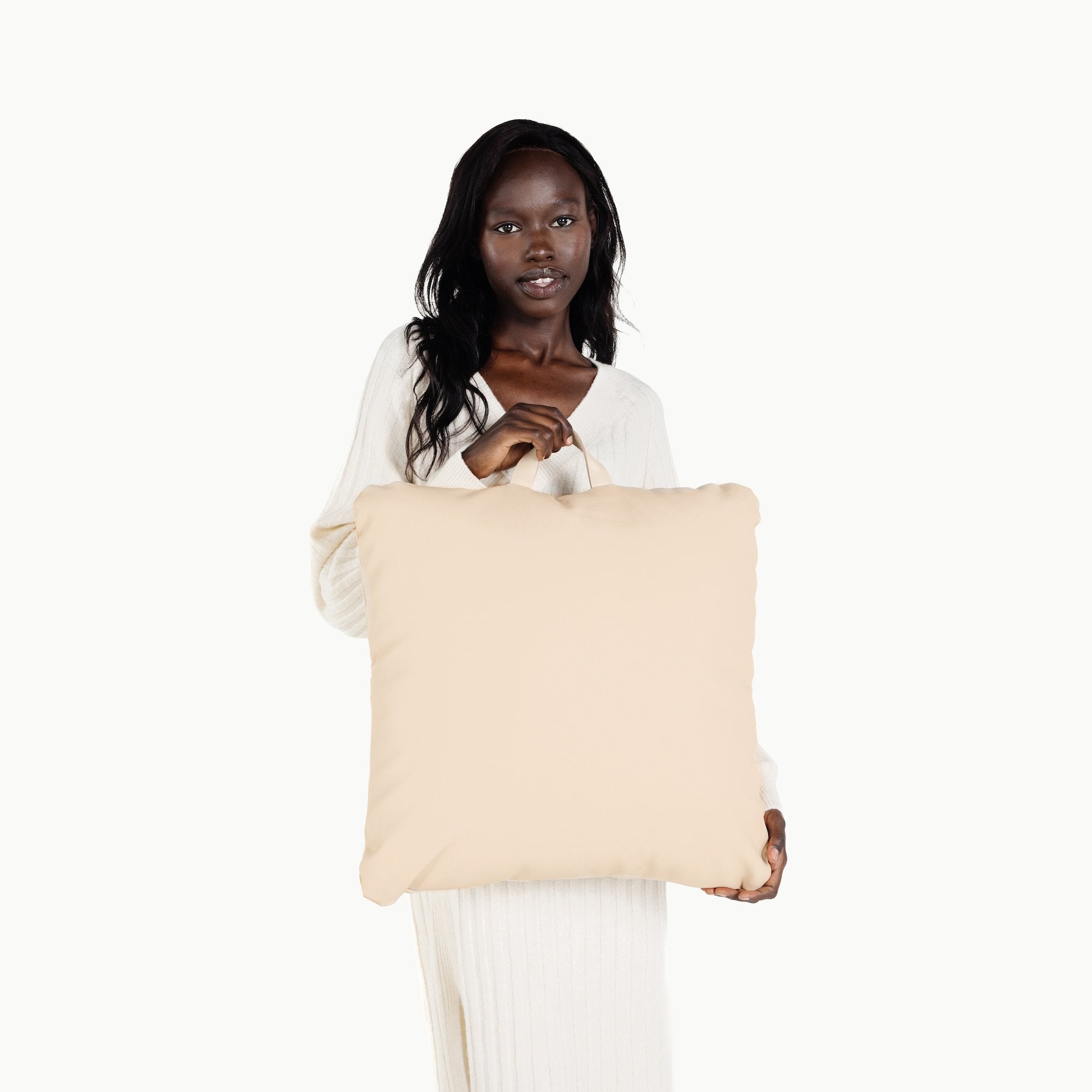 Petal / Square@Woman holding the petal square mini floor cushion