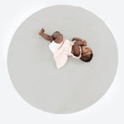 Pewter (on sale)@overhead image of baby laying on pewter padded midi circle