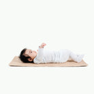 Pomelo (on sale)@Baby laying on the Pomelo Micro+ Mat