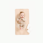 Pomelo (on sale)@Overhead of baby laying on the Pomelo Micro+ Mat