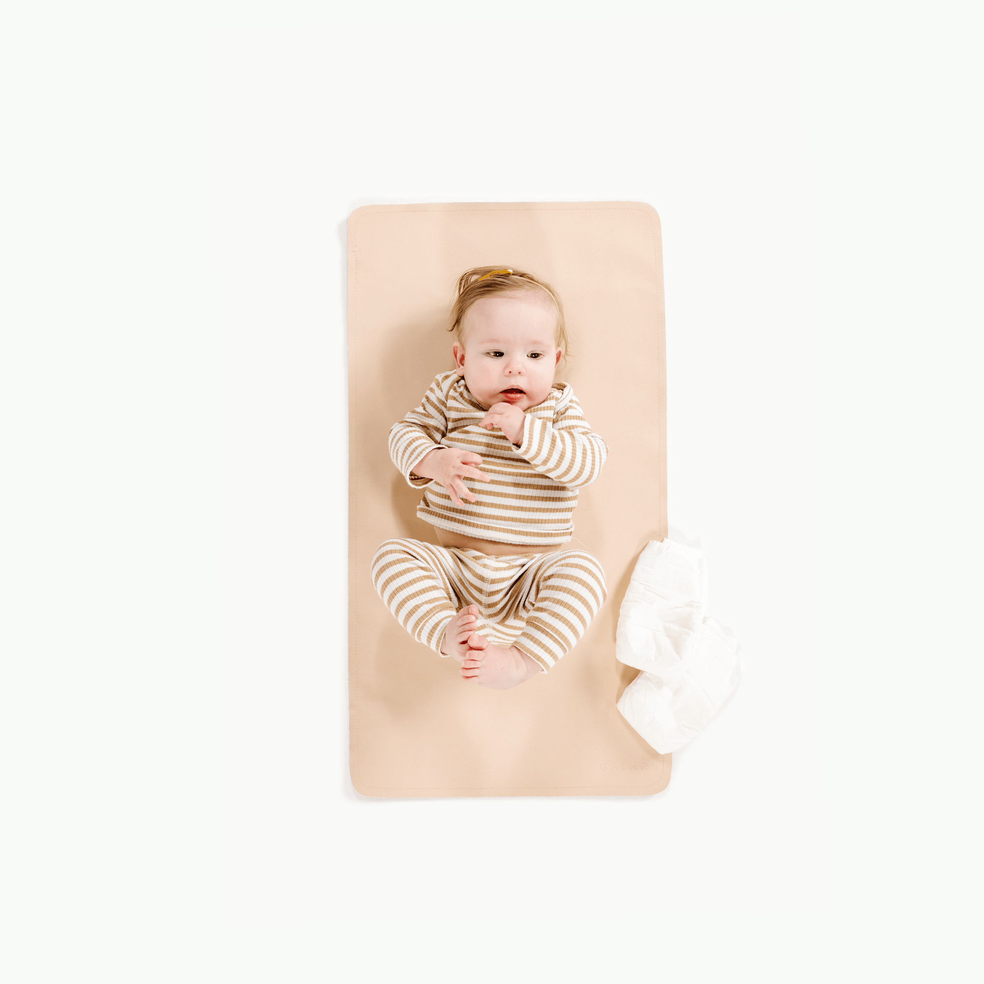 Pomelo (on sale)@Overhead of baby laying on the Pomelo Micro+ Mat