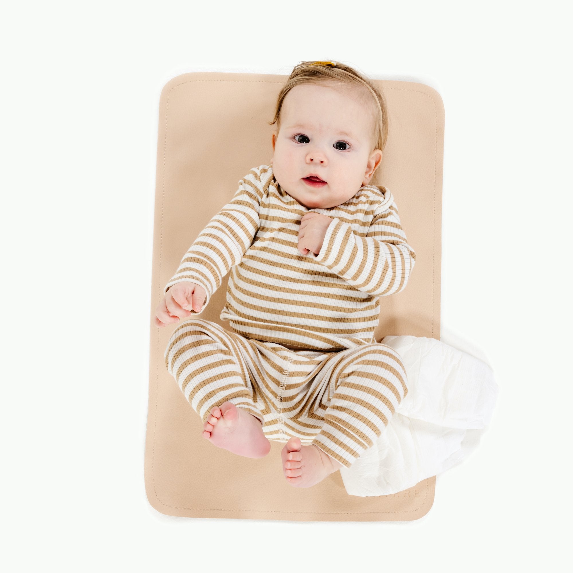 Pomelo (on sale)@Overhead of baby laying on the Pomelo Micro Mat