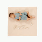 Pomelo (on sale) / Square@overhead image of kid laying on pomelo padded mini