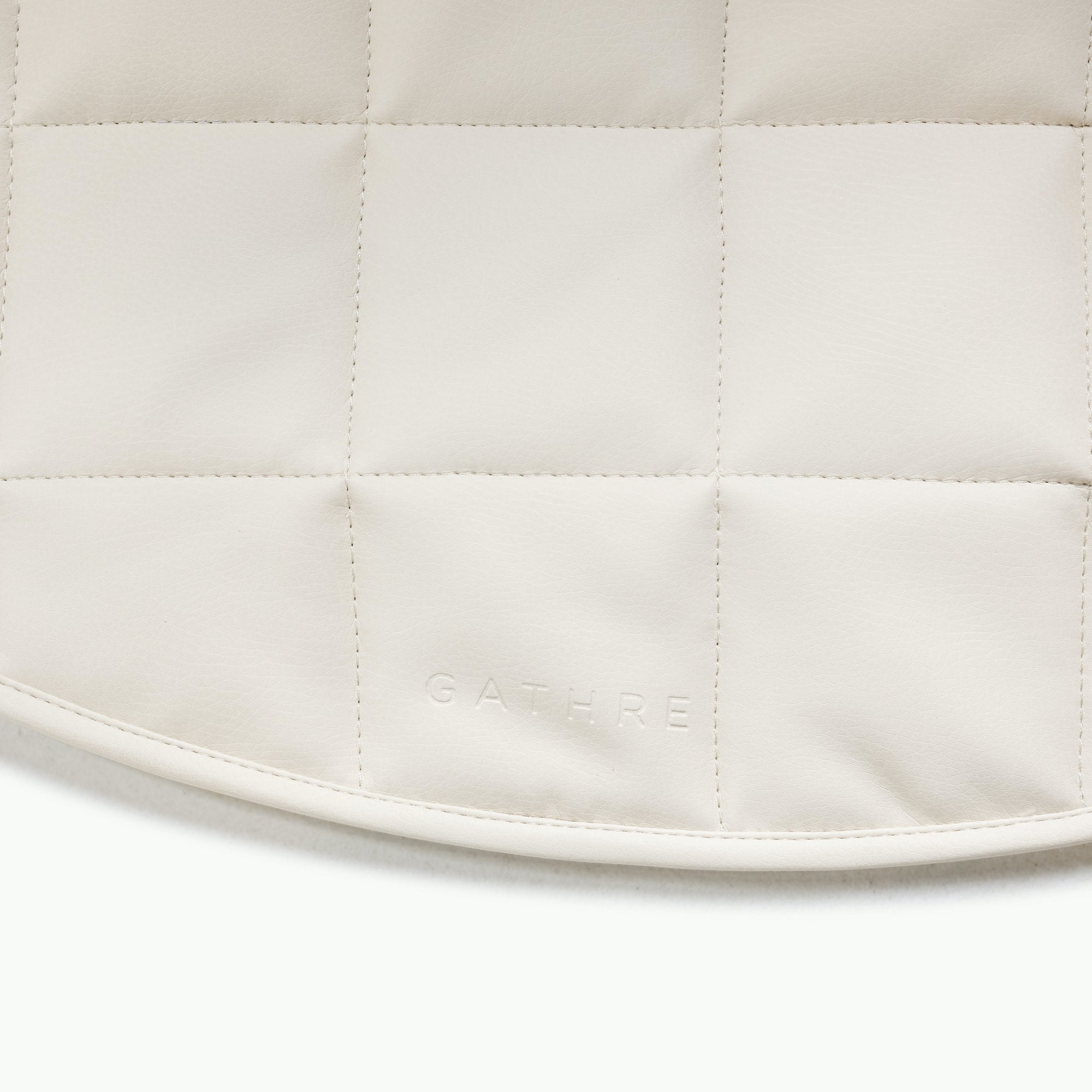 Ivory / Circle@Gathre deboss detail on the Ivory Mini Circle Quilted Mat 