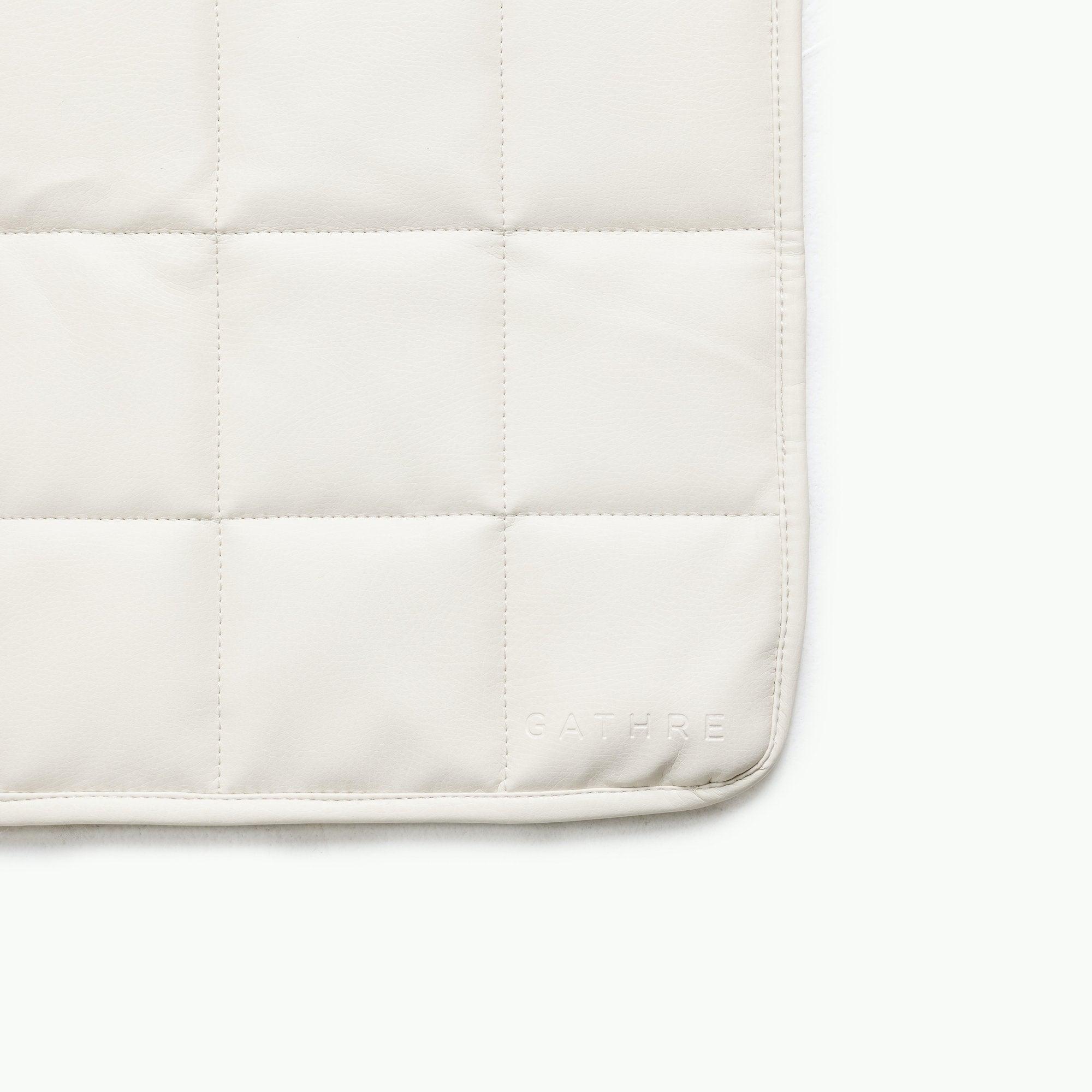 Ivory / Square@Gathre deboss detail on the Ivory Mini Square Quilted Mat 