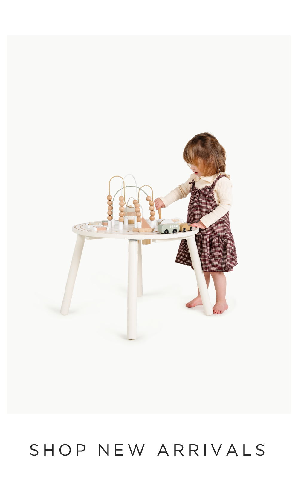 kid playing with the activity table 