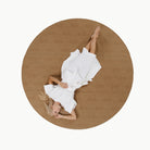 Tannin (on sale) / Circle@Overhead of woman laying on the Tannin Circle Maxi Mat