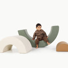 Thyme • Ivory • Camel@Kid playing on the Thyme Arc Playset
