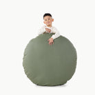 Thyme / Circle@Kid holding the Thyme Circle Floor Cushion