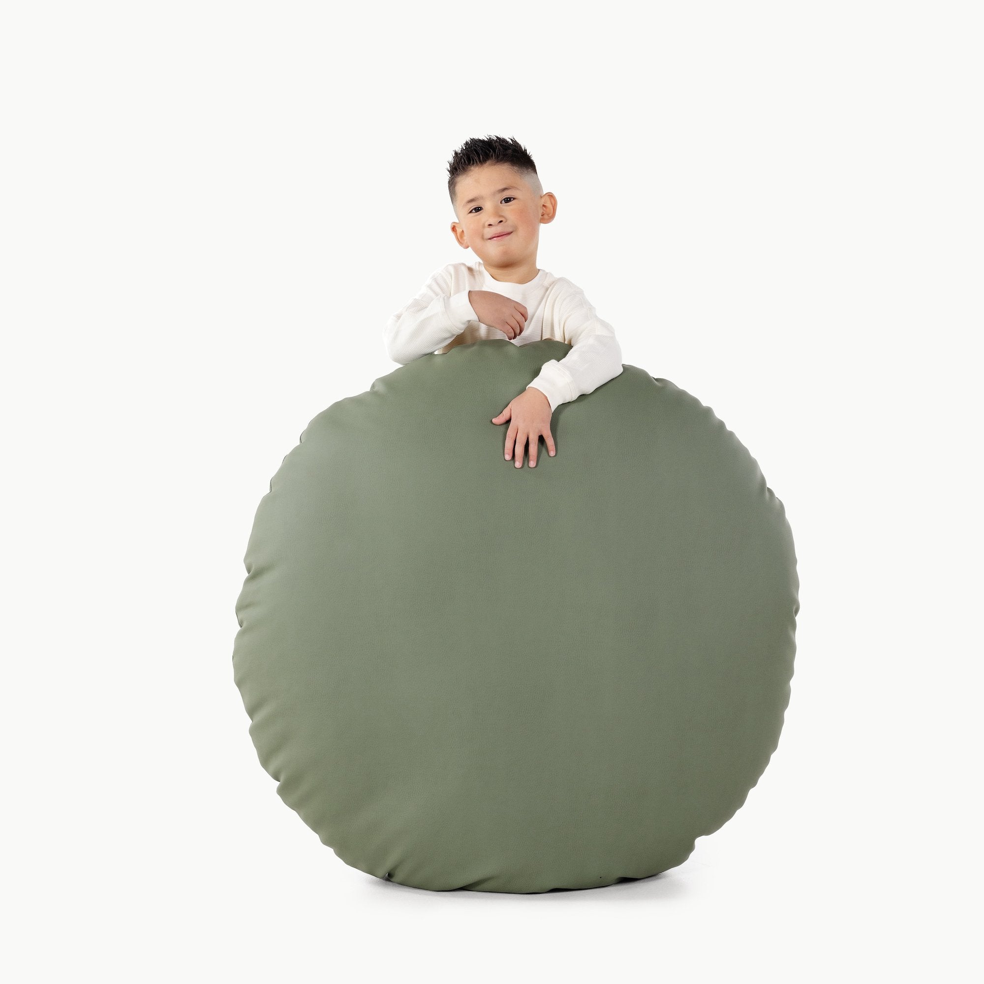 Thyme / Circle@Kid holding the Thyme Circle Floor Cushion
