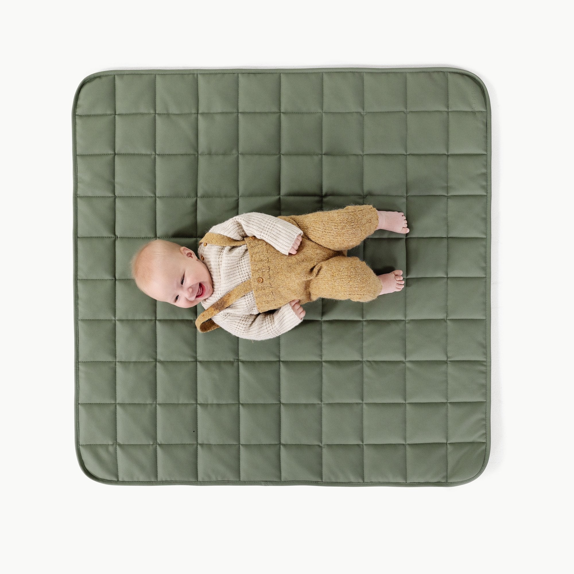 Thyme / Square@Overhead of baby laying on the Thyme Square Quilted Mat