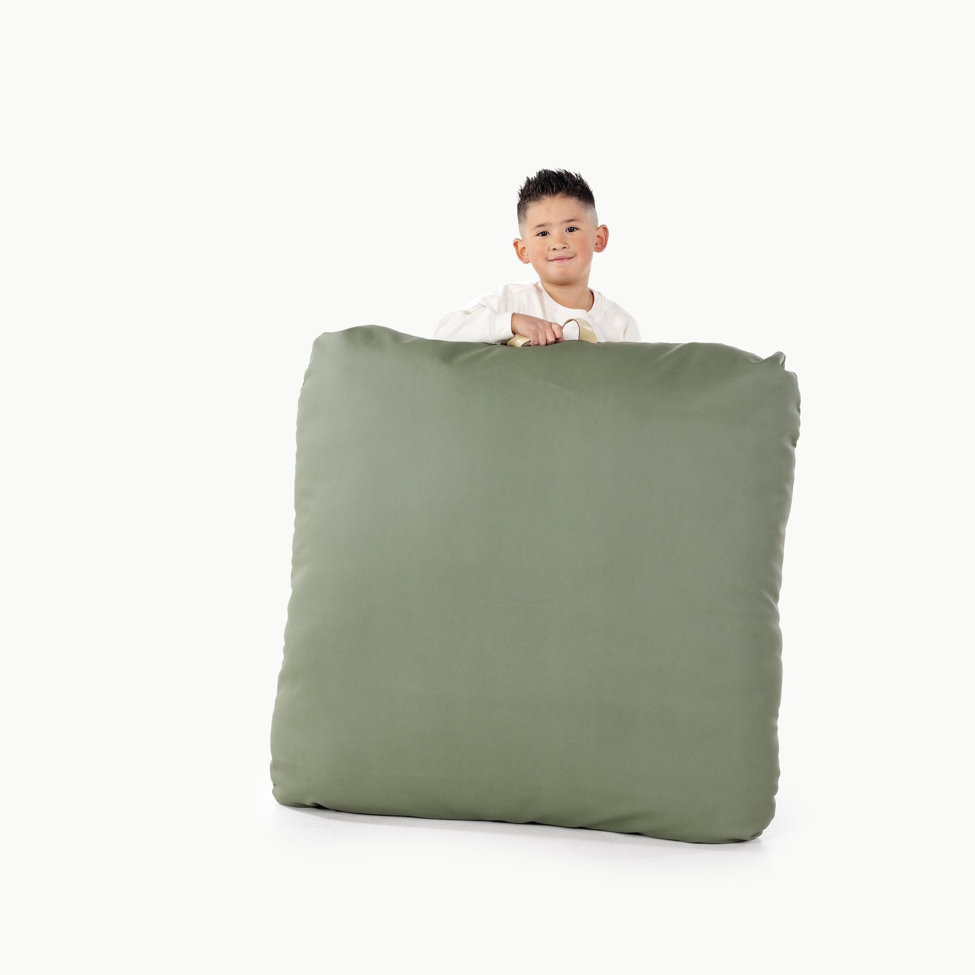 Thyme / Square@Kid holding the Thyme Square Floor Cushion