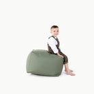 Thyme / Square@Kid sitting on a Thyme Square Pouf