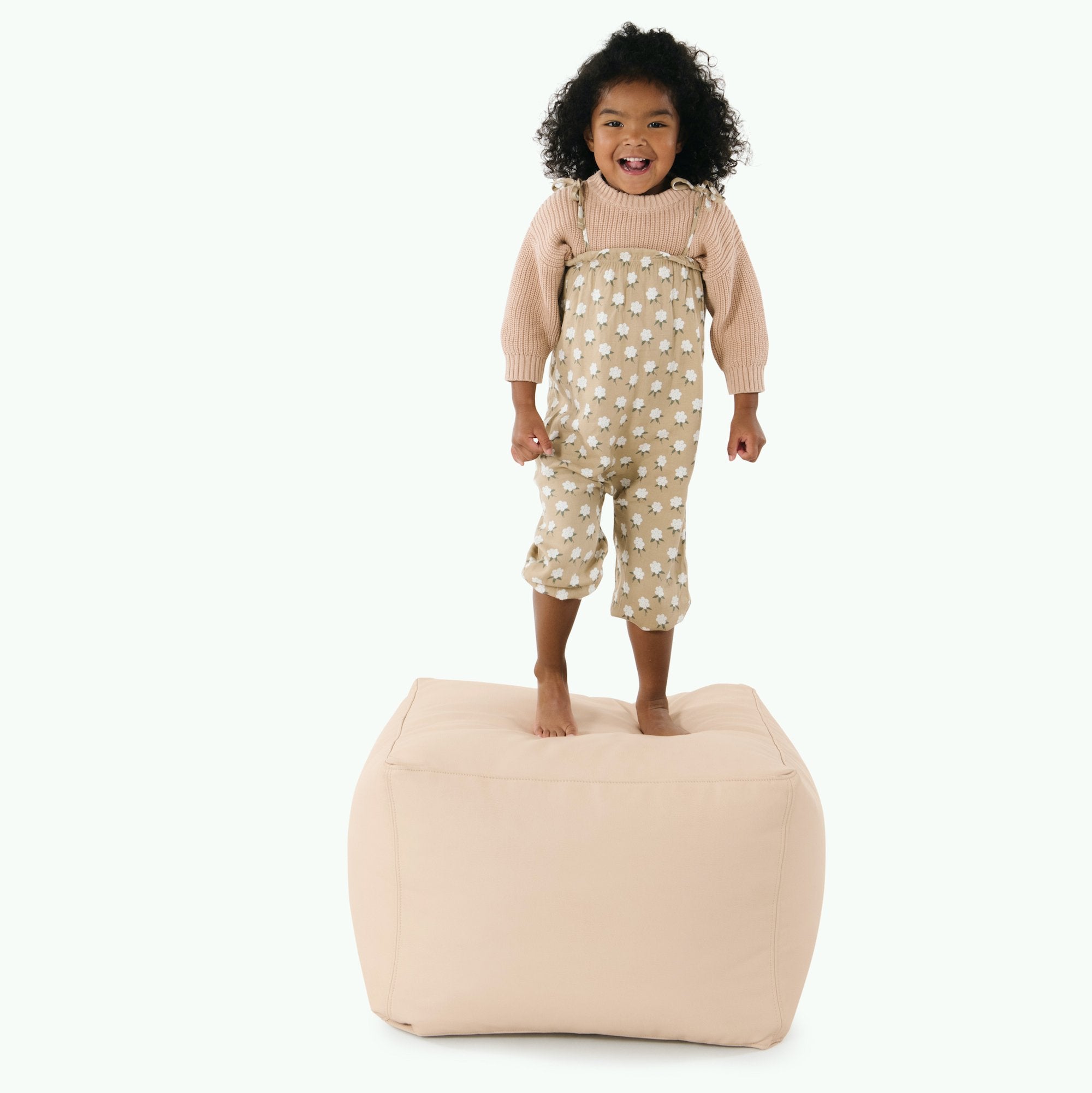 Untanned (on sale)@kid standing on the untanned square pouf 