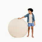 Wool (on sale) / Circle@Kid holding up the Wool Circle Floor Cushion