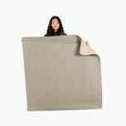 Grove/Millet (on sale) / Square@Woman holding the grove/millet double sided midi mat