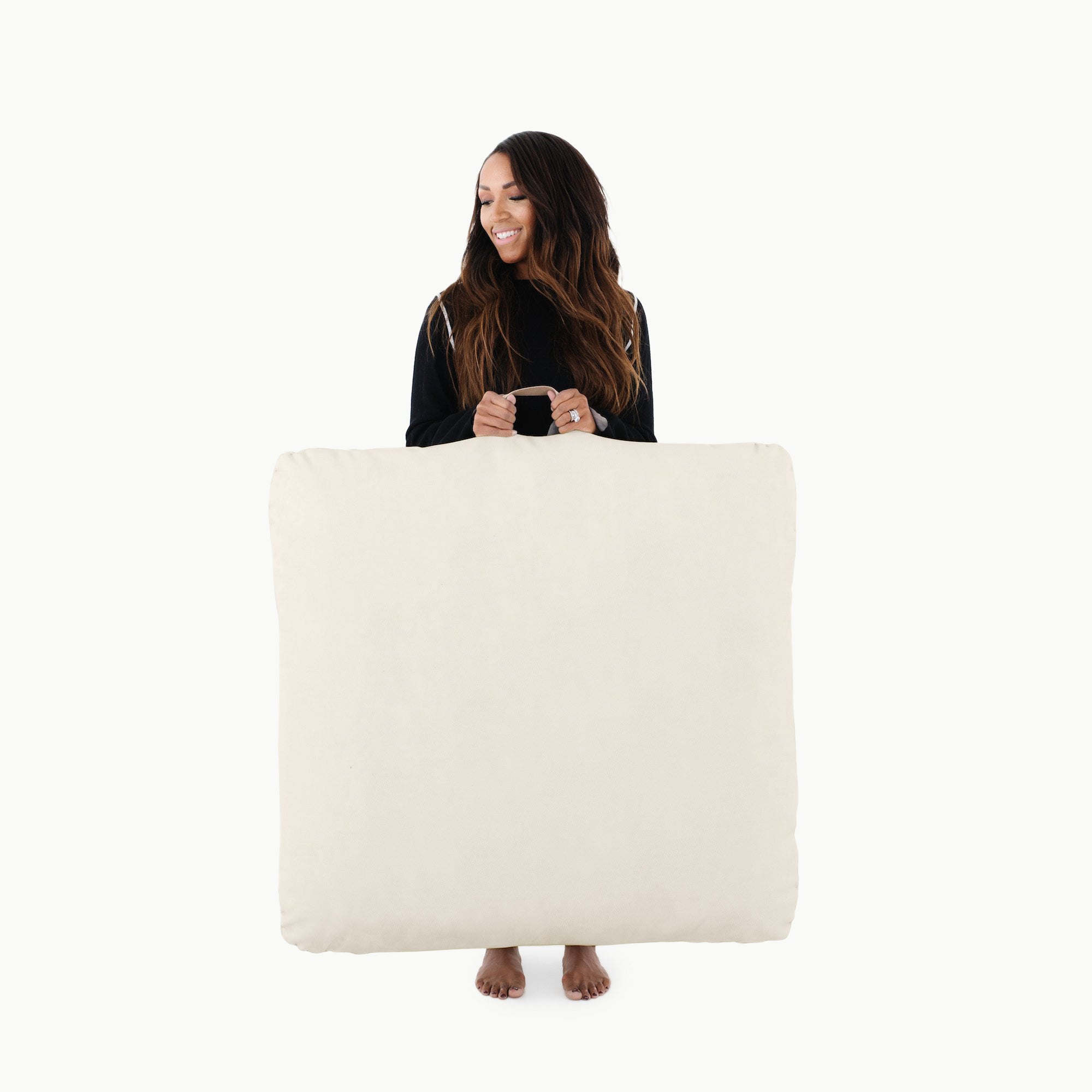 Ivory / Square@woman holding the ivory square floor cushion