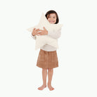 Ivory (on sale)@Kid holding the ivory star pillow 