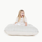 Meadow / Square@kid sitting on the meadow square floor cushion