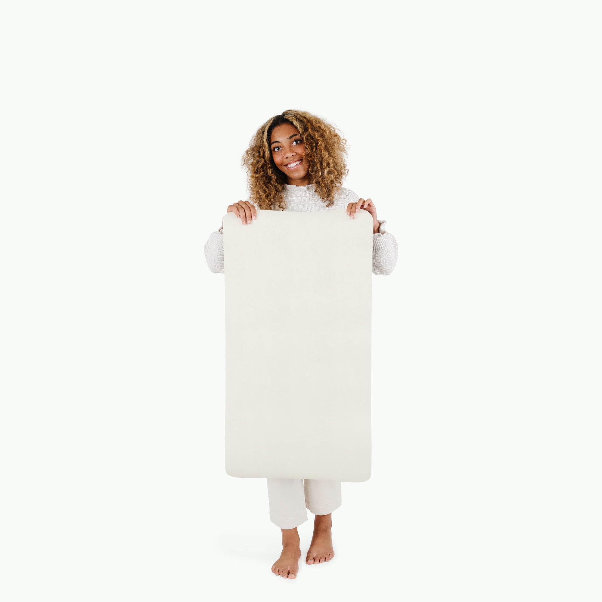 Blanc (on sale)@woman holding up the small blanc home mat